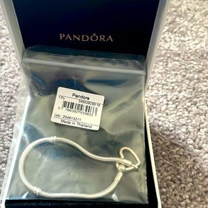 Pandora sterling silver bracelet with a heart clasp